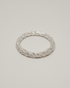 packshot of an organic ring on a light beige seamless background