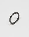 oxidised silver organic ring on a light gray background